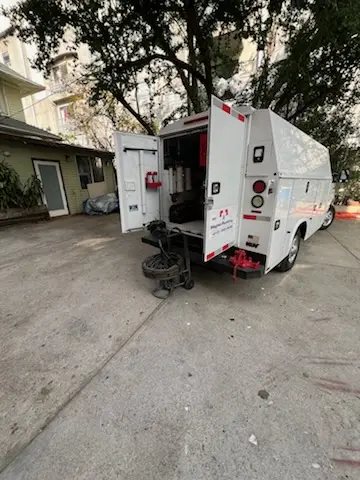 Magnet Plumbing service vehicle on-site for Grease Trap Cleaning in Rubicam